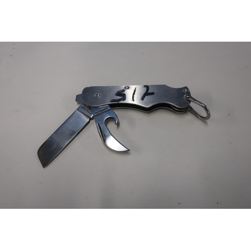 105 - Twin bladed folding knife, polished handle