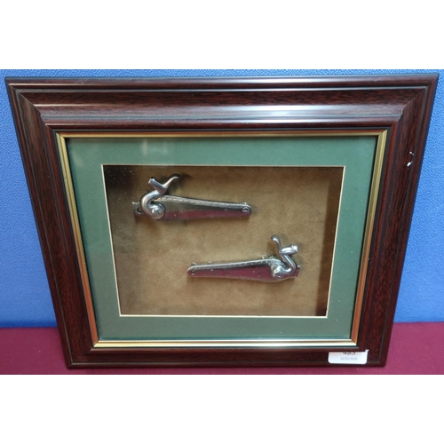 149 - Framed & mounted display of a pair of steel locks for a hammer gun (33cm x 28cm)