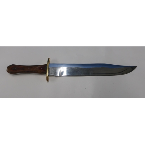 114 - Bowie type knife with 9 inch blade with brass cross piece and two piece wooden grip, made in Sheffie... 