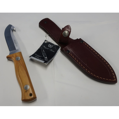 117 - As new Miguel Nieta knife with 4 inch blade in stitched leather sheath