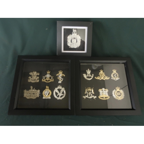 147 - Three small framed and mounted displays of British military cap badges, various regiments including ... 