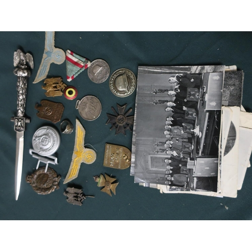 30 - Collection of German WWII badges and insignia including a belt buckle, SS ring, eagle on Swastika pi... 