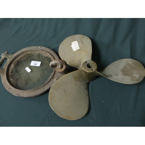 56 - Marine brass propeller and a port hole with glass (D22cm) believed to be from HMS Sincere