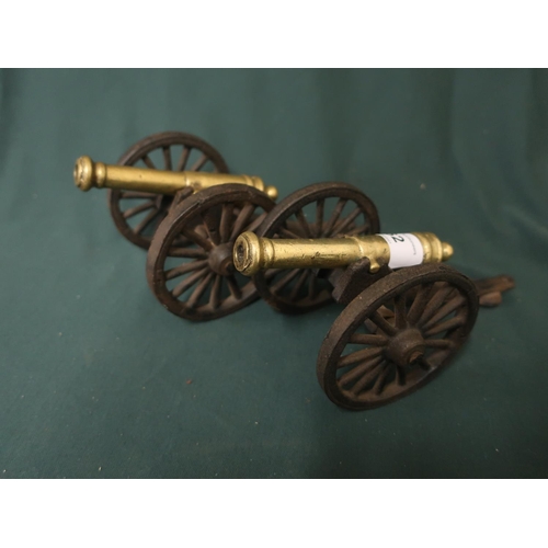 62 - Pair of miniature brass and cast cannons L20cm