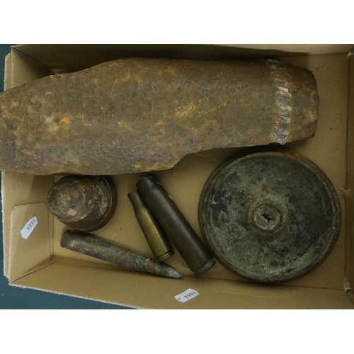 85 - Box containing three shell casings motor bomb head, trench art, and fragment of bomb case