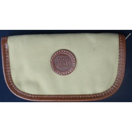 309 - Hardy leather trimmed canvas wallet with sheepskin interior and a Morell fly box, three plastic tack... 