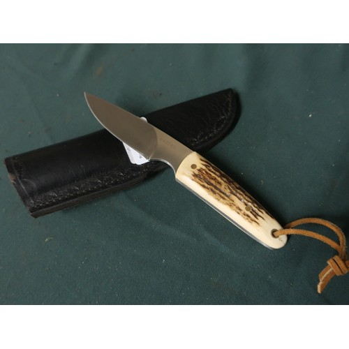 122 - 3 inch bladed sheath knife with two piece Sambar horn grip and leather belt sheath