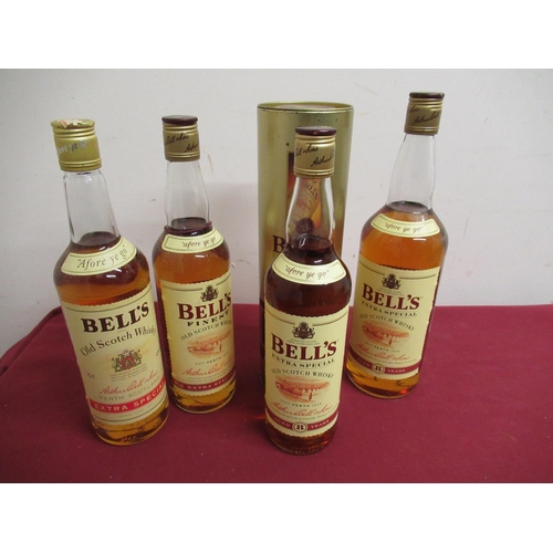146 - Bell's Extra Special Old Scotch Whisky, Aged 8 years, 1ltr, similar 75cl, two others 70cl, one in ti... 