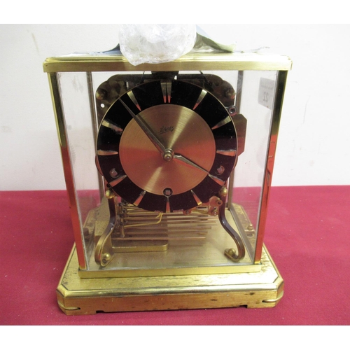 22 - Mid 20th C Schatz mantel clock lacquered brass case  with four glazed panels on platform base, three... 