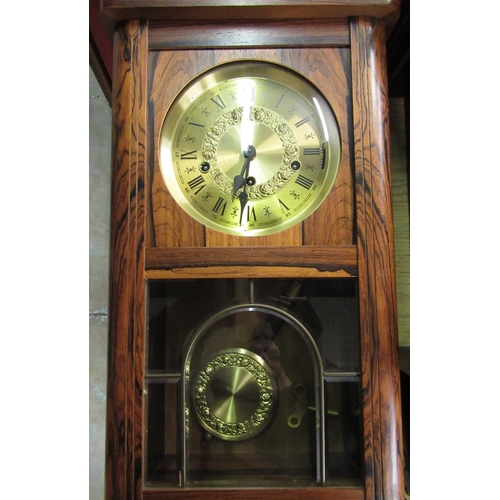 39 - Late 20th C German wall in clock simulated rosewood case, single glazed leaded panel door enclosing ... 