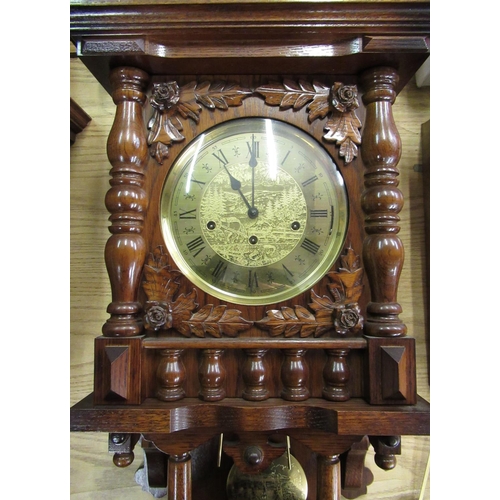 42 - Late 20th C German wall clock in carved oak case with turned finials and gallery, single glazed door... 