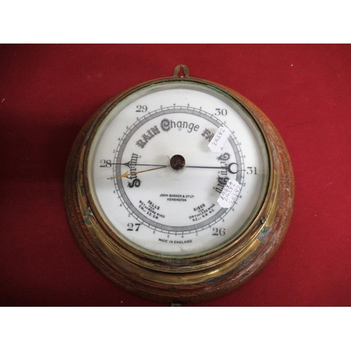 69 - John Barker & Co Ltd Kensington brass cased bulk head aneroid barometer, on golden oak backboard D19... 