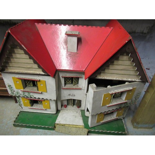 121 - Double fronted dolls house with two opening bays containing a small quantity of wooden and other fur... 