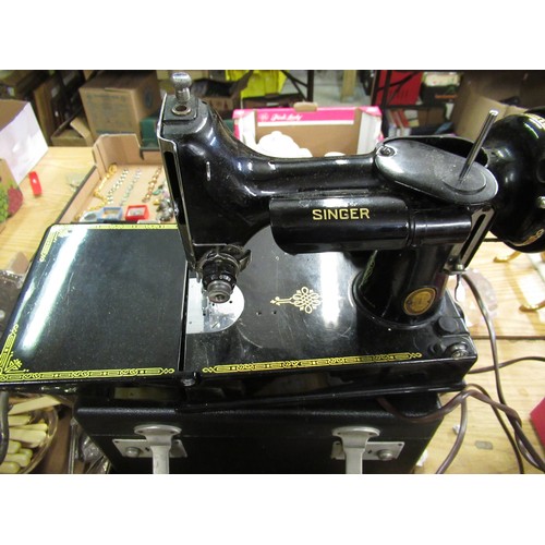 185 - Small Singer portable electric sewing machine with foot pedal control and in original black case mac... 