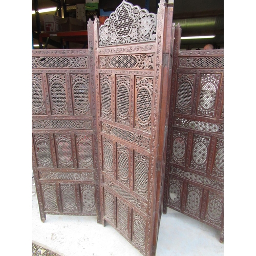 253 - Moorish hardwood three panelled screen, the four panels with pierced floral and leafage decoration H... 