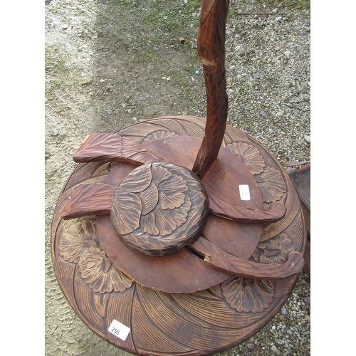 255 - Graduated pair of eastern two tier occasional tables with the two floral carved tiers on angular cab... 