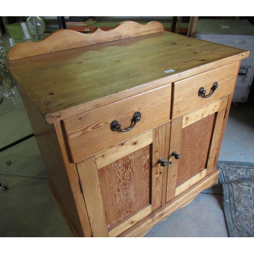 274 - Early 20th C pitch and other pine side cabinet with raised back above two drawers and two panelled d... 