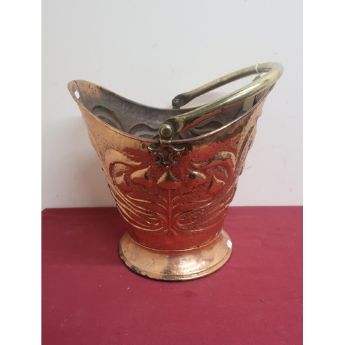 472 - Art Nouveau copper and brass coal helmet, comical design, circular foot, H50cm W37cm