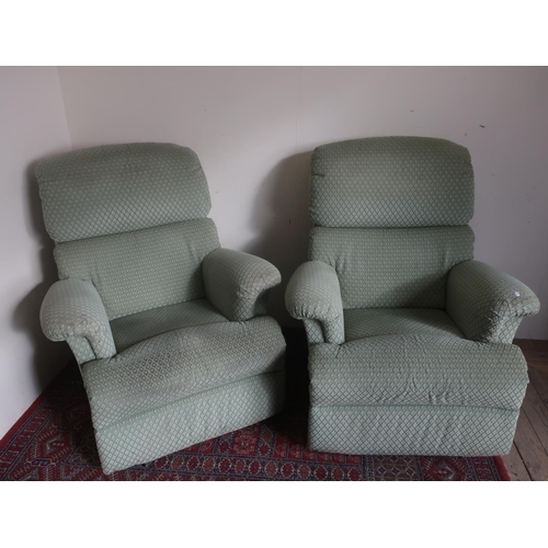 565 - Pair of Sherborne manual reclining armchairs upholstered in green draylon