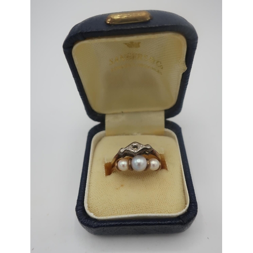 484 - 9ct gold ring set with three simulated pearls, and another gold ring stamped 18ct