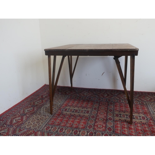 556 - Early 20th C oak folding table, planked top with locking folding legs, stenciled in black trade mark... 