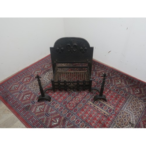 529 - Cast Iron fire basket, with stepped arch back with relief fleur del lis decoration, and similar turn... 