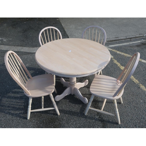 230 - Painted pine circular dining table with four stick back chairs