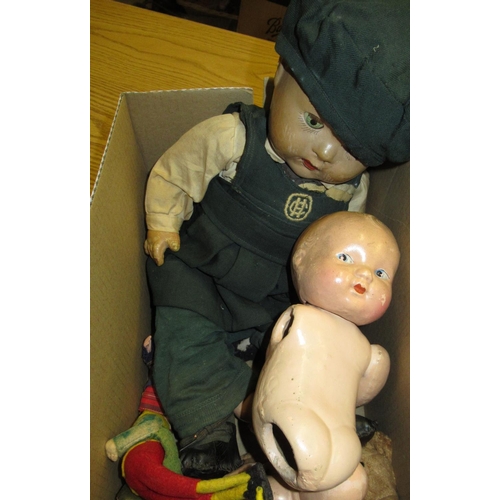 179 - Composition doll with opening eyes and jointed limbs, in green school uniform H48cm, another baby do... 