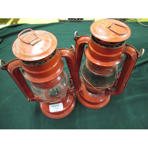 185 - Pair of vintage red Tilley type hand lanterns, H37cm (2)