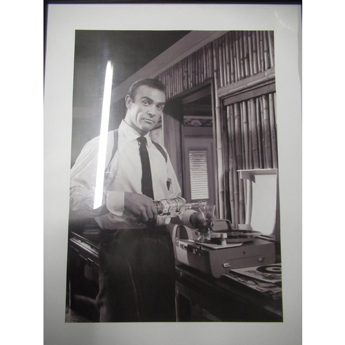 212 - Framed and mounted black & white photograph of Sean Connery as James Bond, 84cm x 64cm