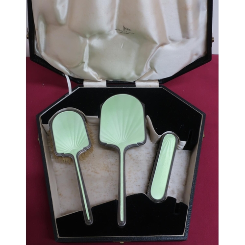 126 - Geo.VI silver and green enamel backed three piece dressing table set, Chester 1938, by Walker & Hall... 