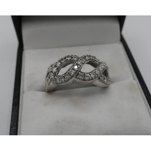 283 - 9ct white gold hallmarked diamond set open work ring, approx total .75ct, size O