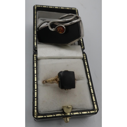 302 - 9ct gold ring set with Whitby Jet square size N, and a Whitby Jet & amber Coffin ring size Q (2)