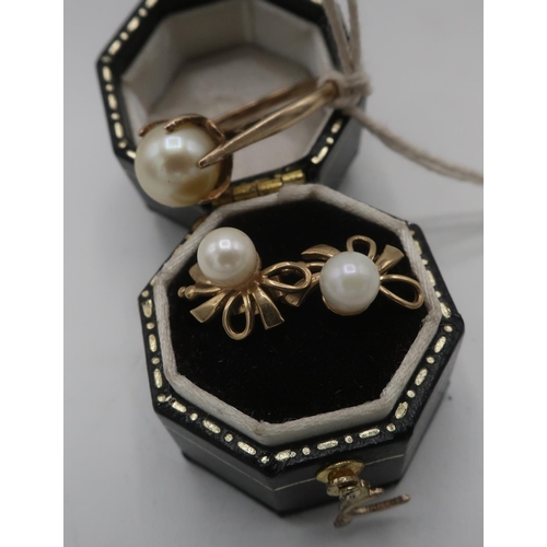 311 - Pair of gold pearl earrings, stamped 9ct and a 9ct gold hallmarked pearl ring, size L (2)