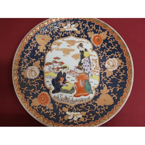 1 - Large Japanese circular charger, the centre decorated with females in a landscape in a blue ground c... 