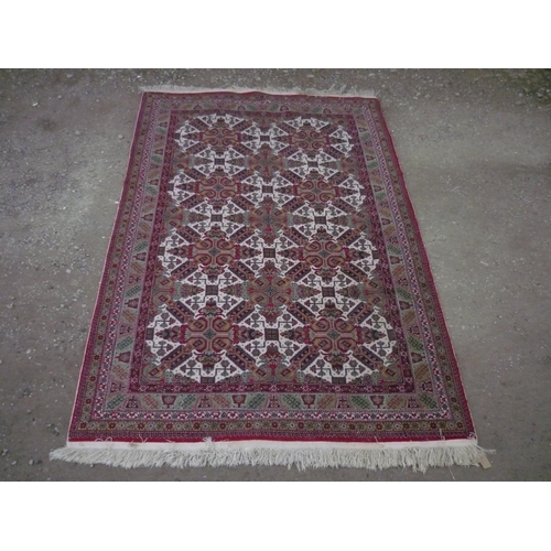 109 - 20th C Kayseri traditional Middle Eastern patterned rug, red ground with geometric patterned field a... 