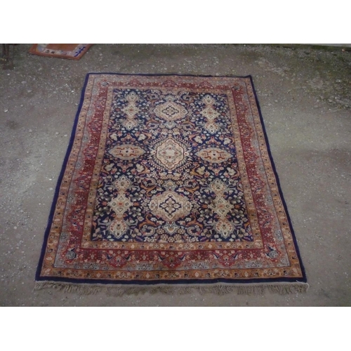 110 - 20th C traditional Middle Eastern patterned rug, blue ground with scroll centre medallion and rust b... 