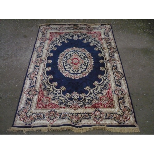 111 - 20th C silk style traditional pattern rug, blue ground with central stylized floral medallion and fl... 