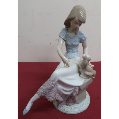 12 - Lladro porcelain figure of a girl seated with a puppy and a parasol, No 7612, and two similar Lladro... 