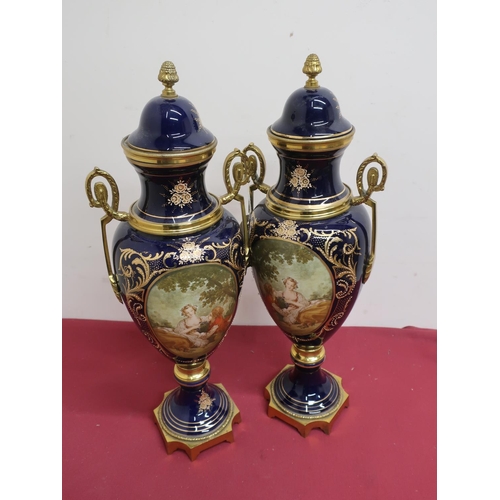 22 - Pair of Serves style gilt metal mounted urn shaped vases and covers, bodies decorated with lovers in... 
