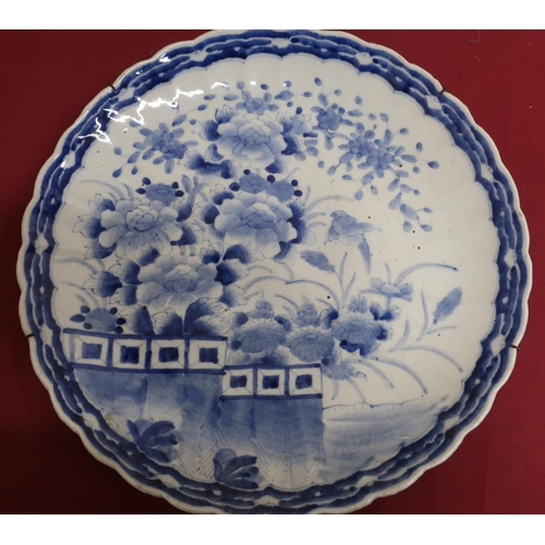 7 - Japanese waved edge circular blue and white charger, all over decorated with chrysanthemums on a ter... 