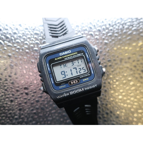 317 - Casio LCD DW-240 200m alarm chronograph, synthetic case on rubber strap, stainless steel back stampe... 