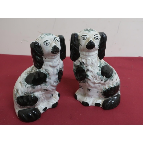 352 - Pair of late Victorian Staffordshire fire side spaniels with green sponged decoration, H20cm (2)