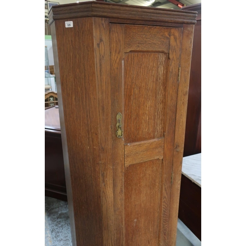 326 - 20th C oak hall wardrobe, with panel door enclosed by canted corners W71cm H177cm D33cm