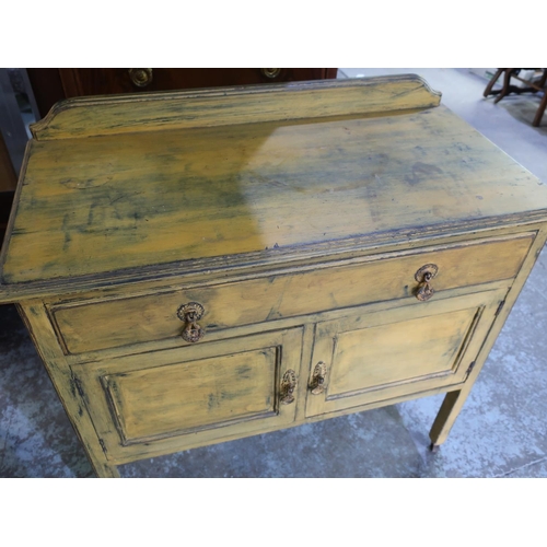 334 - 20th C oak side cabinet, with drawer above a pair of cupboard drawers, with vintage mustard paint fi... 