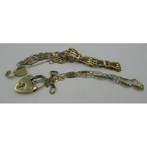 92 - Two 9ct gold hallmarked fancy link bracelets with padlock clasps, and another padlock, 10.8g (3)
