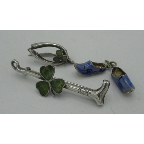 96 - Pair of silver and blue enamel Dutch clog charms stamped 835, silver riding crop bar brooch set with... 