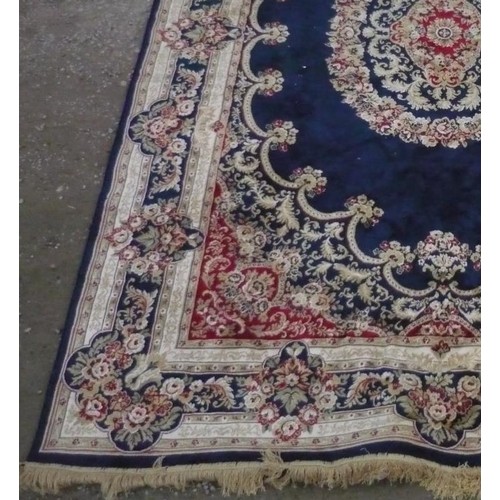 111 - 20th C silk style traditional pattern rug, blue ground with central stylized floral medallion and fl... 