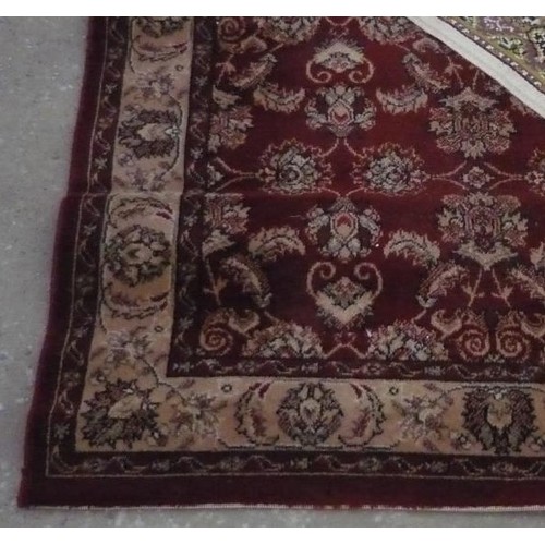 116 - Traditional pattern acrylic rug, brown ground with central floral patterned field 107cm x 170cm and ... 