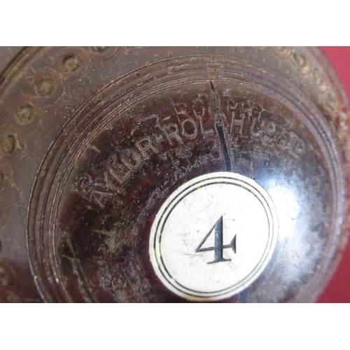 543 - 20th C Taylor-Rolph Co Ltd, London, Lignum Crown green bowls numbered 1 and 4, and three Hislop's ar... 